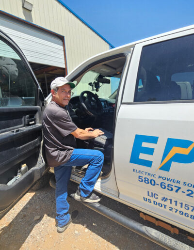 Man standing next to truck.